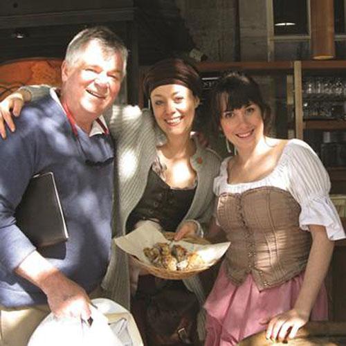 The Galley Guys are greeted by the hostesses at the themed restaurant Caberet du Roy for a taste of New France in Old Montreal, on Rue Saint-Paul. © The Galley Guys